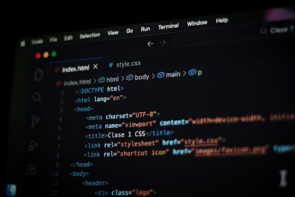 The image shows a computer screen displaying a code editor with HTML and CSS code. The code window features tags such as <html>, <head>, <title>, and <link> for stylesheet references, with syntax high